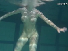 UhEbony presents: Naked brunette with big tits swims solo