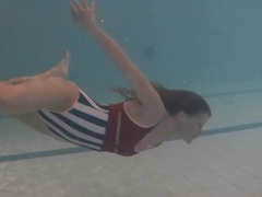 UhEbony presents: Leggy girl swims and strips naked in pool