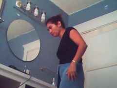 UhEbony presents: Voyeur camera captures naked chick in bathroom